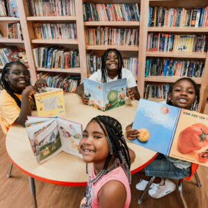 kids in library with books